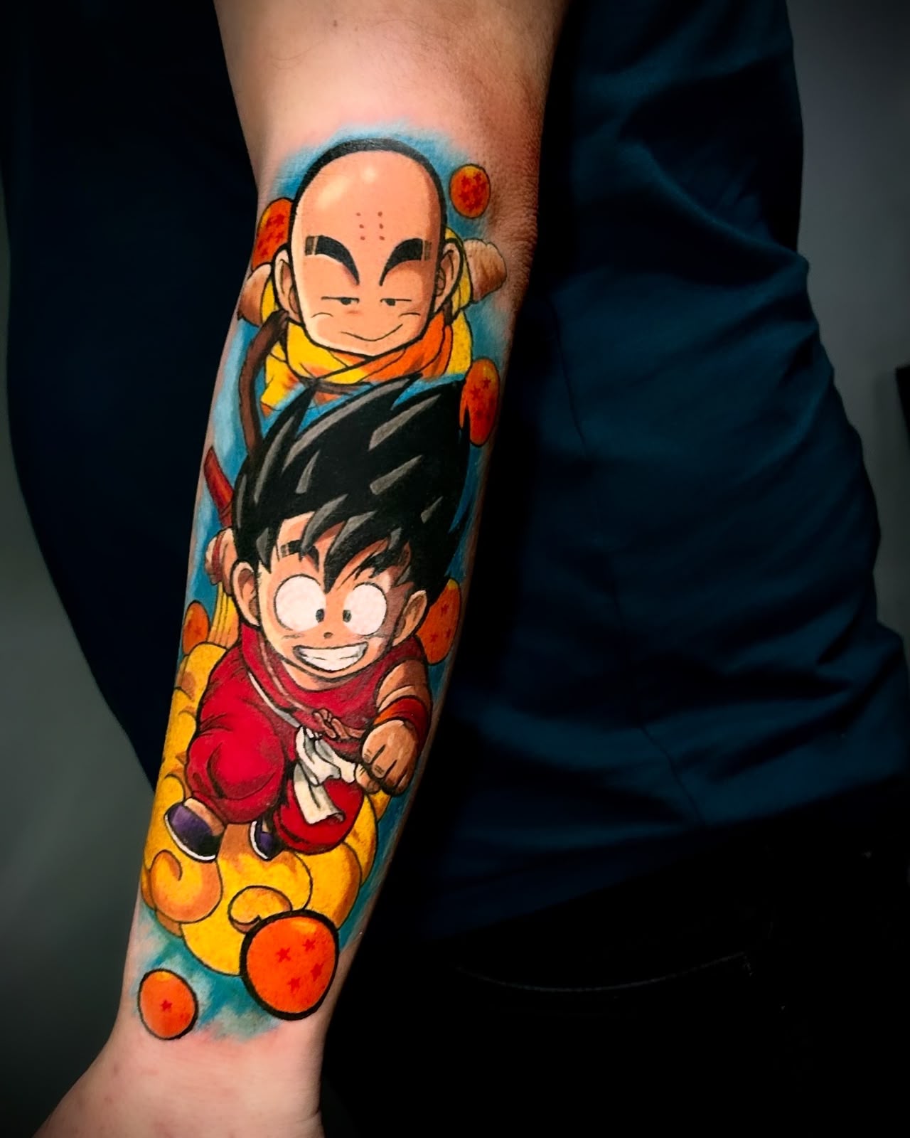 Tatuagem Anime Nuvem Voadora na região antebraço feita por Simone Centeno em Porto Alegre